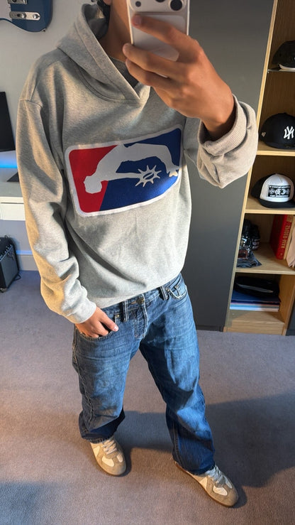 Solaire Hoodie in grey worn with jeans in a mirror selfie